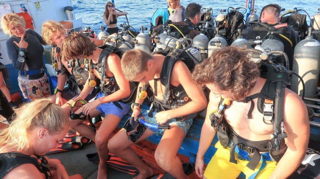 Open Water students checking scuba equipment before training
