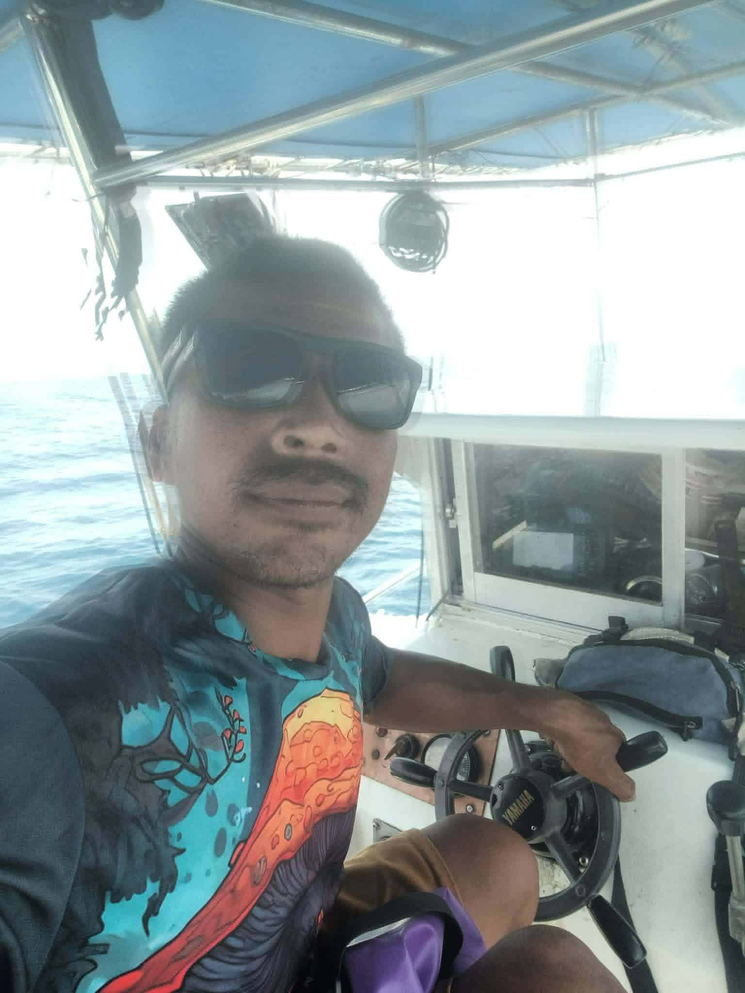 Local fishing captain on a boat in Koh Tao