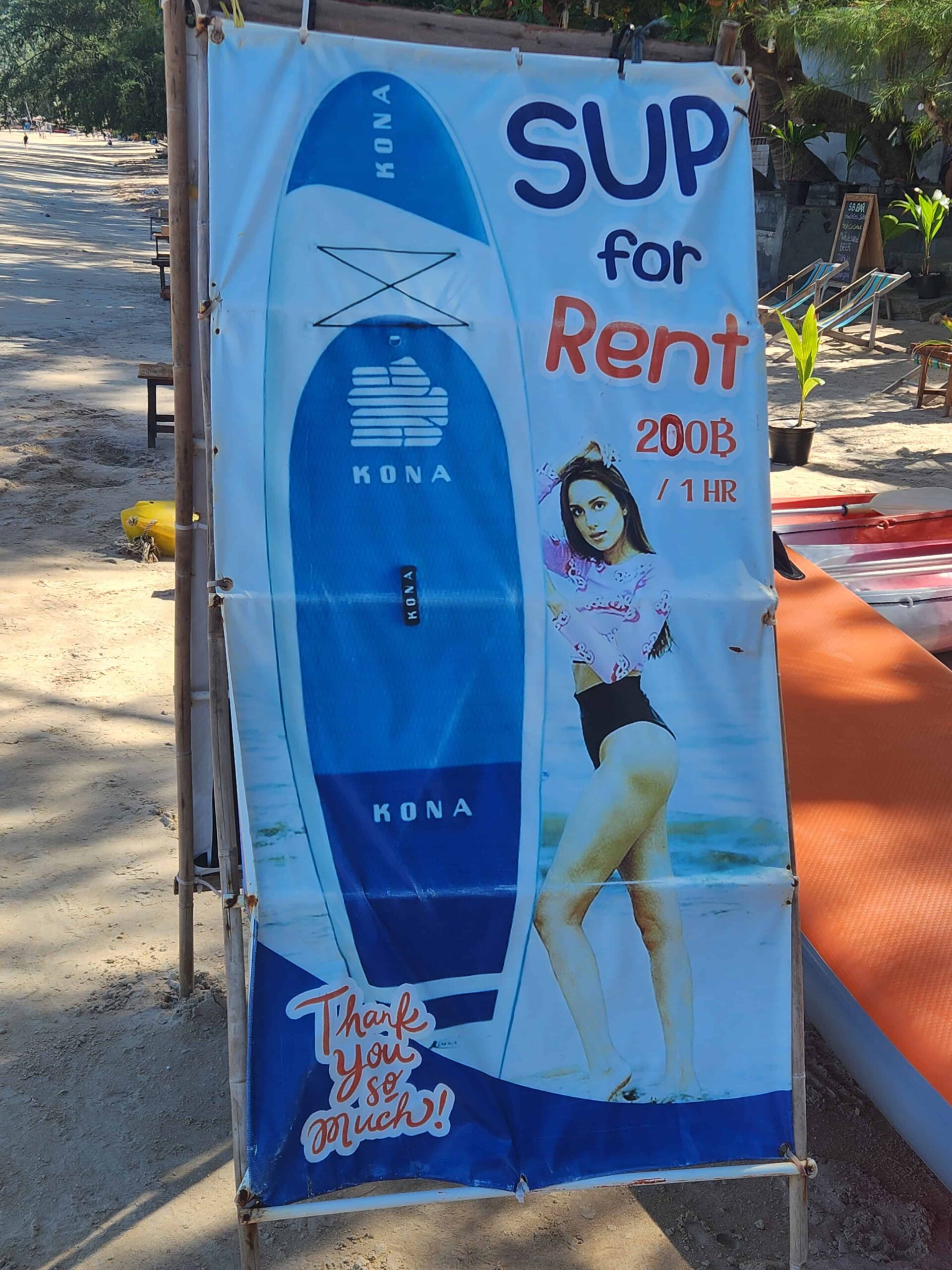 SUP rental price sign near Paradise Massage on Sairee Beach